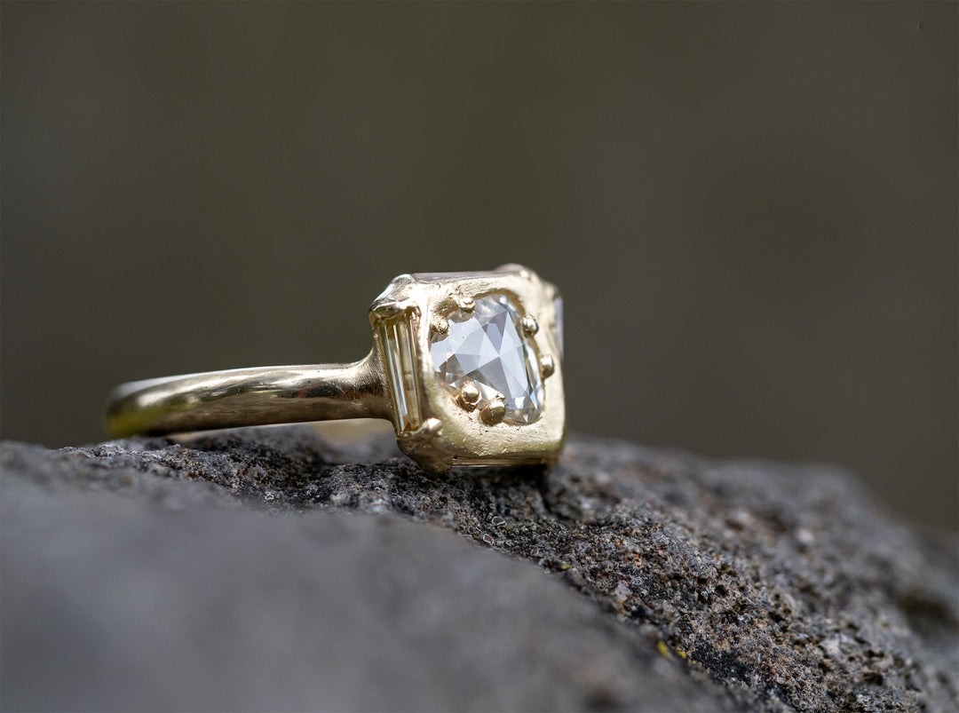 Hocerat rose cut diamond ring with oxidized silver and textured gold details, displayed on a dark background