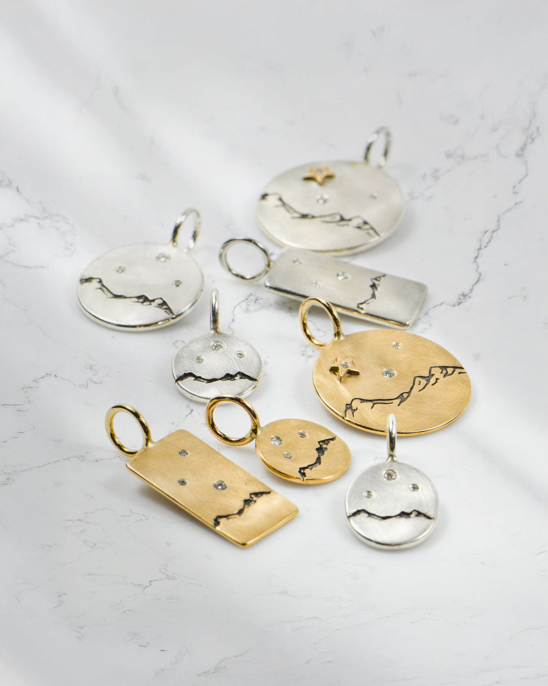 Heather B. Moore Three Sisters mountain range charm in precious metal, capturing Bend’s iconic peaks