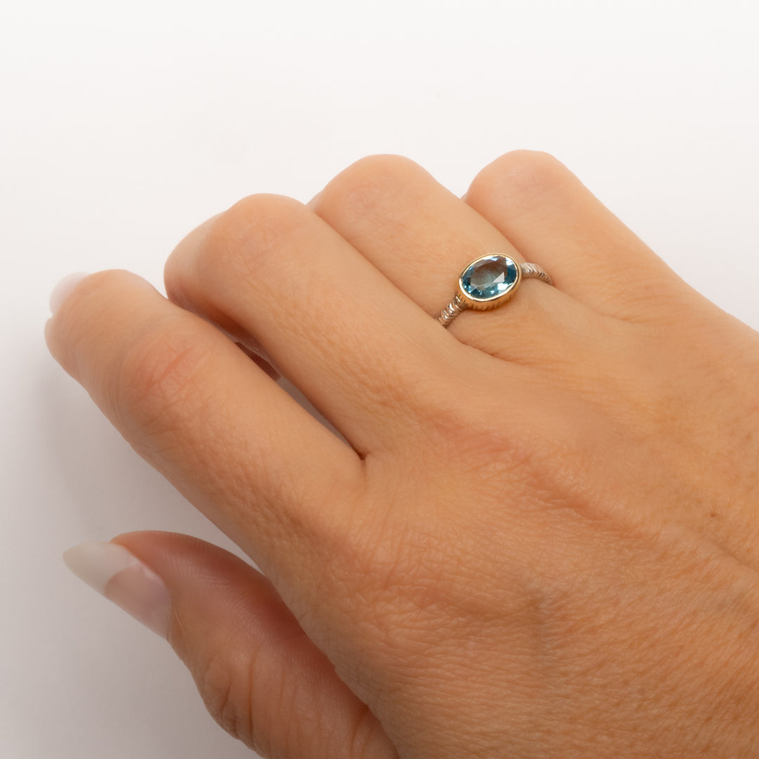 Small Oval Faceted Blue Topaz Ring