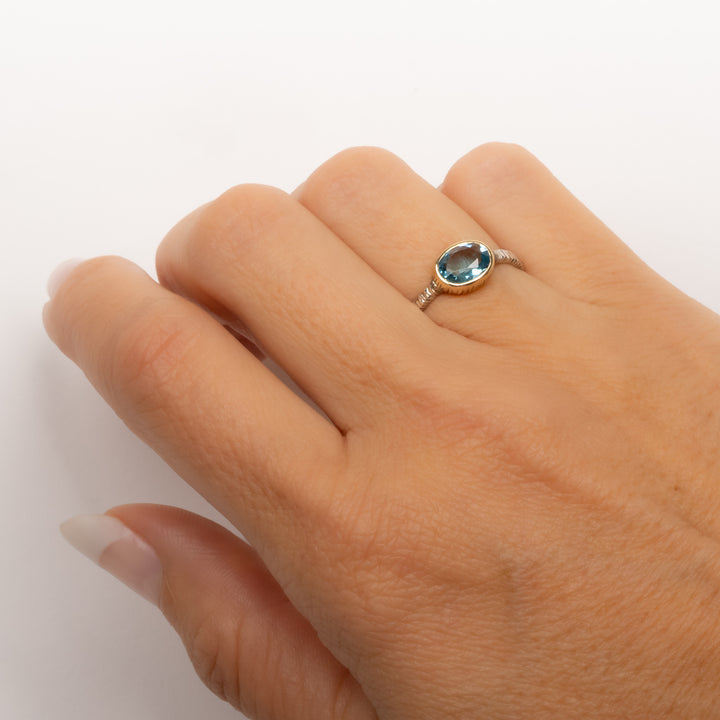 Small Oval Faceted Blue Topaz Ring