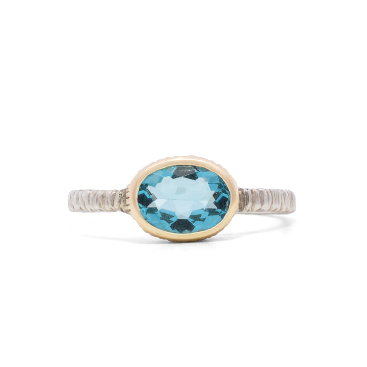 Small Oval Faceted Blue Topaz Ring